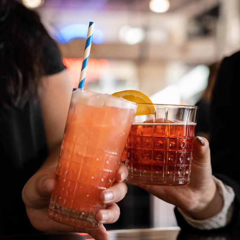 Friends raising cocktails at SoulBelly BBQ